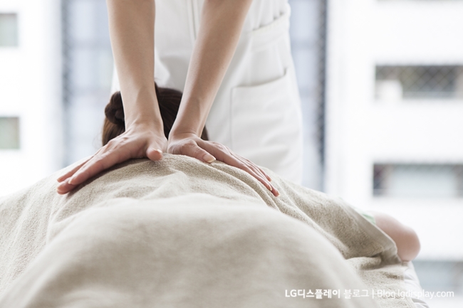 Women receiving back massage