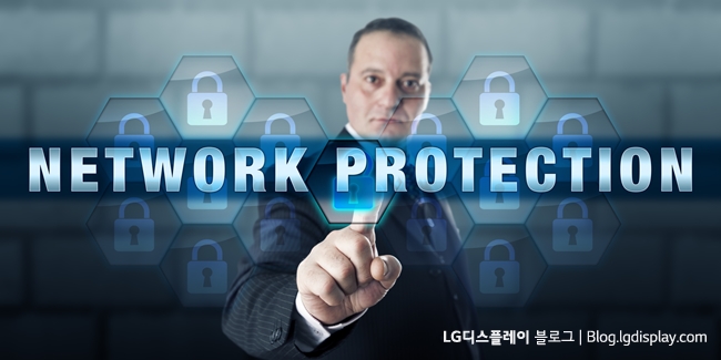 Security manager is touching NETWORK PROTECTION on an interactive visual display. Business metaphor and information technology concept for securing enterprise computing infrastructure.