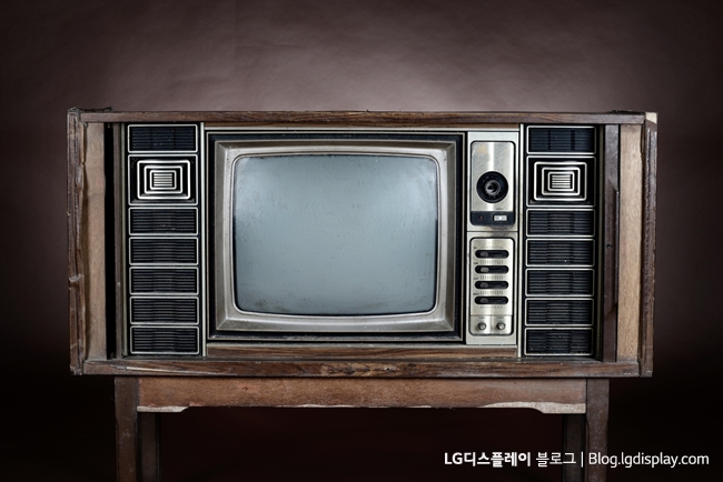 Vintage television on brown background